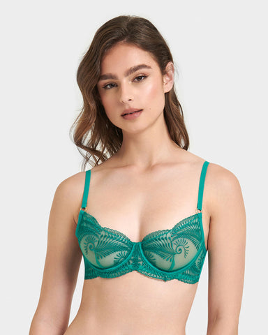 A sheer, green embroidered balconette bra with gold toned sliders and a delicate leafy pattern.
